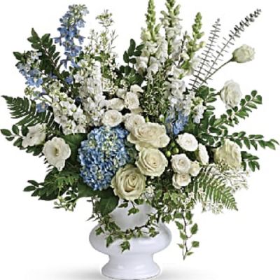 <div class="m-pdp-tabs-description">
<div id="mark-1" class="m-pdp-tabs-marketing-description">A treasured tribute to your beloved, this gorgeously grand bouquet of soft blue hydrangea and pure white roses is reminiscent of a clear sky, a hopeful reminder of life and love.</div>
</div>
<p id="arrngDescp">This beautiful bouquet of light blue hydrangea, white roses, white spray roses, white lisianthus, light blue delphinium, white snapdragons, white stock, and white waxflower is accented with huckleberry, variegated ivy, spiral eucalyptus, dagger fern, and lemon leaf. Delivered in a white designer urn.</p>