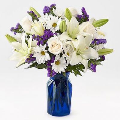 Gift your friends and family the freshest and most beautiful bouquet of lilies, roses and statice. Perfect for complementing any message you want to send, our Beyond Blue Bouquet features a deep blue vase and a gorgeous array of white and purple blooms.

STANDARD
C Quantity	Color	Description
3	Ivory	50 cm Standard Rose - Escimo
2	White	LA Hybrid Lily
5	White	Daisy Pom
3	Purple	Filler - Sinuata Statice
3	Green	Green - Leather Leaf

DELUXE

C Quantity	Color	Description
5	Ivory	50 cm Standard Rose - Escimo
3	White	LA Hybrid Lily
5	White	Daisy Pom
4	Purple	Filler - Sinuata Statice
3	Green	Green - Leather Leaf

PREMIUM

C Quantity	Color	Description
6	Ivory	50 cm Standard Rose - Escimo
4	White	LA Hybrid Lily
5	White	Daisy Pom
4	Purple	Filler - Sinuata Statice
3	Green	Green - Leather Leaf