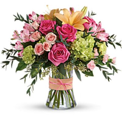<div id="mark-3" class="m-pdp-tabs-marketing-description">Put a spring in their step with this beautifully blushing bouquet of hot pink roses, soft peach lilies and fresh green hydrangea. Arranged in a graceful vase tied with a charming bow, it's a chic treat for any occasion!</div>
<div id="desc-3">
<ul>
 	<li>This sweet arrangement features green hydrangea, hot pink roses, pink spray roses, peach asiatic lilies, pink alstroemeria, green carnations, pink miniature carnations, seeded eucalyptus, parvifolia eucalyptus, and lemon leaf.</li>
</ul>
</div>