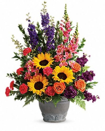 <div class="m-pdp-tabs-description">
<div id="mark-1" class="m-pdp-tabs-marketing-description">A colorful reminder that brighter days are ahead, this uplifting arrangement of sunflowers and roses in an elegant large antiqued pot brings joy and hope.</div>
</div>
<p id="arrngDescp">This bright arrangement includes orange roses, pink alstroemeria, hot pink carnations, yellow sunflowers, purple larkspur, purple stock, hot pink snapdragons, myrtle, variegated pittosporum, and leatherleaf fern.</p>