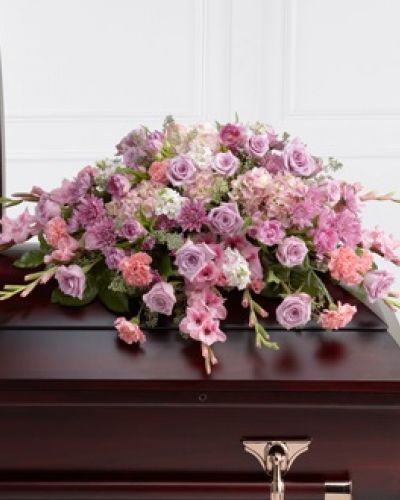<p>The FTD® Immorata™ Casket Spray offers soft beauty and blushing comfort to honor the life of the deceased. Lavender roses, chrysanthemums and parrot tulips are elegantly arranged amongst pink carnations, gladiolus, stock, hydrangea and lush greens to create a presentation, intended to bedeck the top of the casket, that evokes sweet memories of your loved one for their final farewell service.</p>